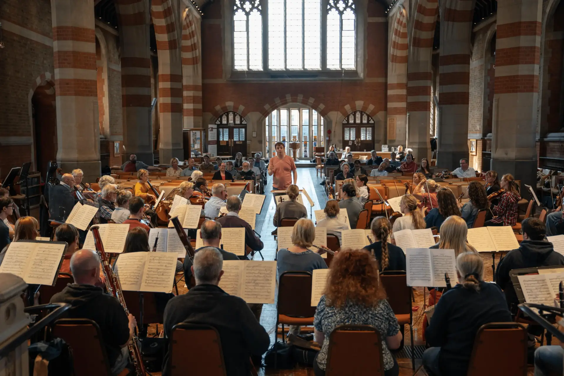 Orchestra playing in a cathedral