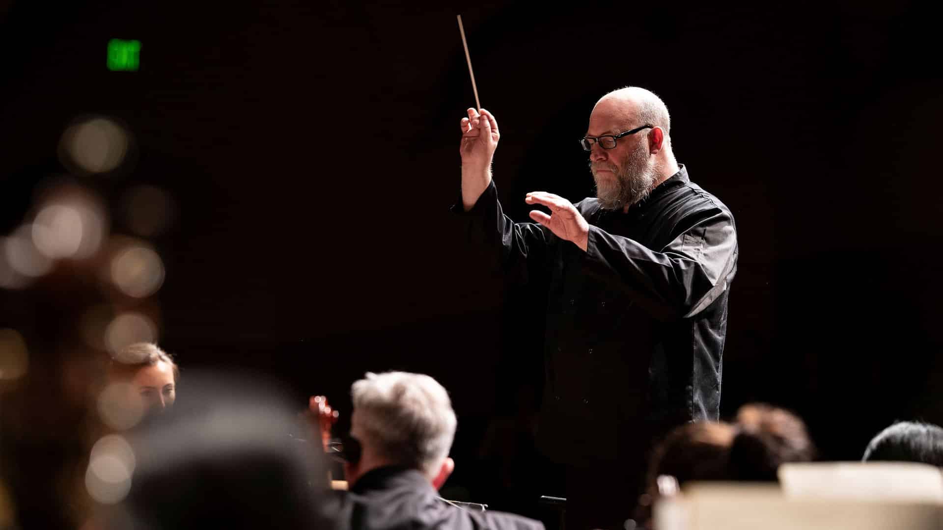 Action shot of Ken Woods conducting