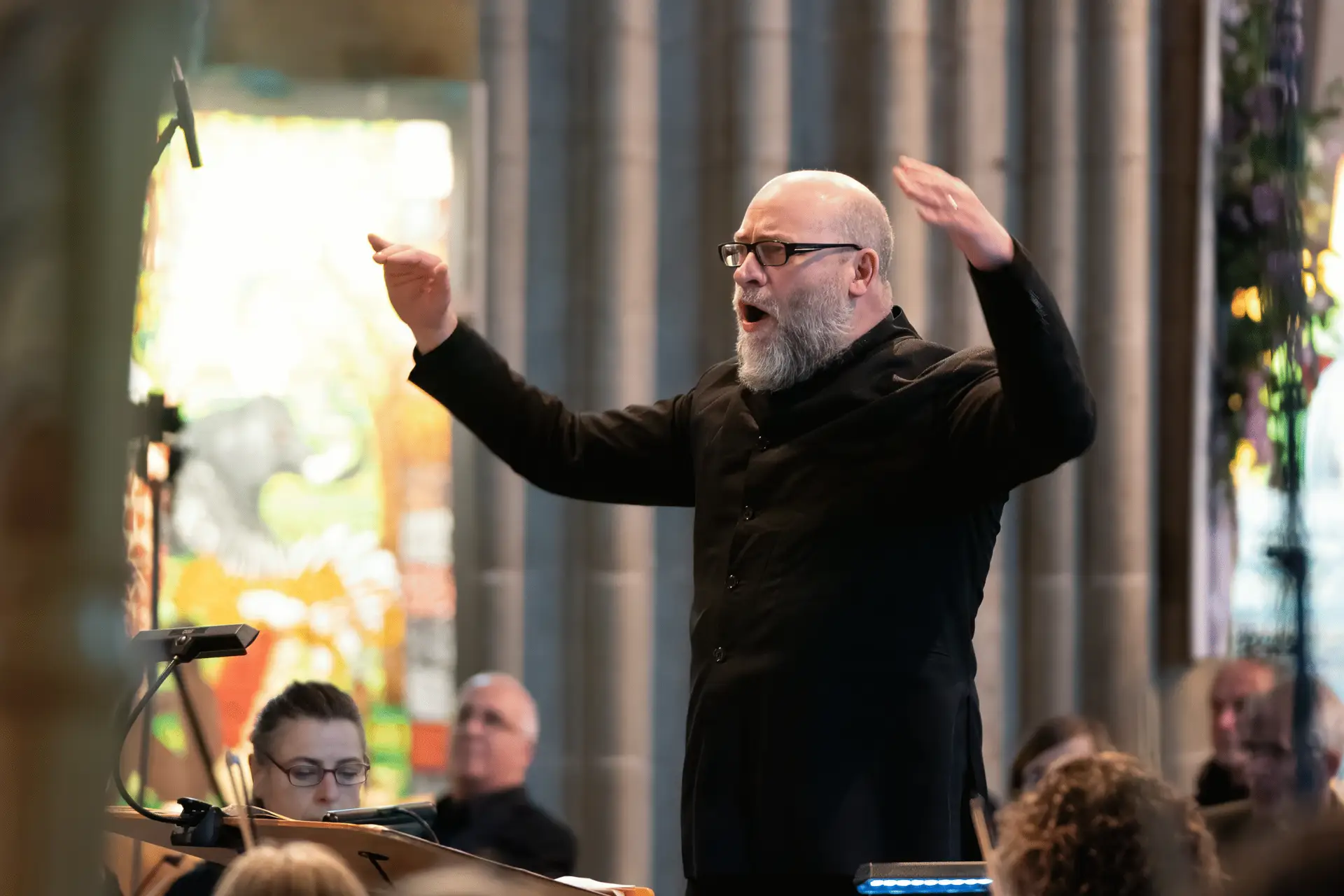 Action shot of Ken Woods conducting